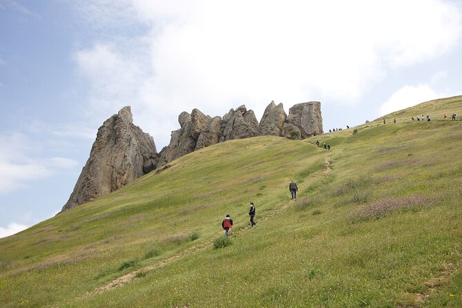 Beshbarmag mountain with sea view and Candy Mountains <em> Day Tour – The five best reasons to book this day tour’ /></p>
<ul>
<li><strong>Masazir Lake can turn pink:</strong> Morning light gives the salt lake its most striking color, with reddish sand along the shore.</li>
<li><strong>Candy Cane Mountain is naturally striped:</strong> Beige, pink, and white bands run through the hills, creating one of Azerbaijan’s oddest photo stops.</li>
<li><strong>Beshbarmag combines scenery and belief:</strong> The five-finger-shaped mountain is both a major natural landmark and a place where local people still come to pray.</li>
<li><strong>The route works well for a short Baku stay:</strong> You see several sights beyond the city without arranging separate transport.</li>
<li><strong>Small groups make a difference:</strong> With a maximum of 12 people, guides can usually explain more and keep the day moving.</li>
<li><strong>The price includes useful basics:</strong> For $60 per person, you get an air-conditioned vehicle, a professional guide, tea, and pickup from selected hotels.</li>
</ul>
<h2 id="why-this-route-works-so-well-from-baku">Why this route works so well from Baku</h2>
<p><img width="669" height="446" decoding="async" src=